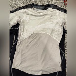 Lot of Under Armor compression training tops.
